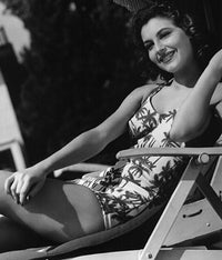 Ava Gardner sitting in a swimsuit photo print