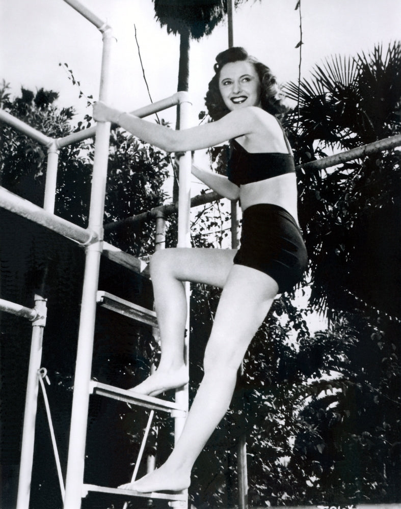 Barbara Stanwyck Ladder Photo Print showcasing classic Hollywood elegance.