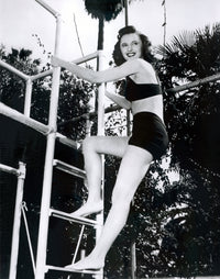Barbara Stanwyck Ladder Photo Print showcasing classic Hollywood elegance.