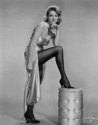 Angie Dickinson Stool Photo Print showcasing classic Hollywood elegance.