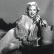 Betty Brosmer Drinking Photo Print showcasing vintage beauty.