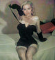 Betty Brosmer in a black outfit photo print showcasing vintage glamour.