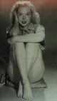 Betty Brosmer Sitting Photo Print showcasing vintage glamour and elegance.
