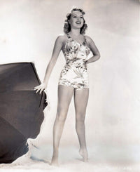 Betty Grable Umbrella Photo Print showcasing classic Hollywood style.