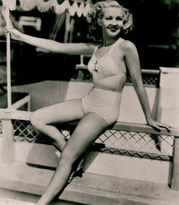 Betty Grable Railing Photo Print capturing classic Hollywood beauty.