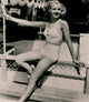 Betty Grable Railing Photo Print capturing classic Hollywood beauty.