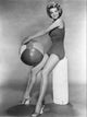 Angie Dickinson Beach Ball Photo Print showcasing classic Hollywood charm.