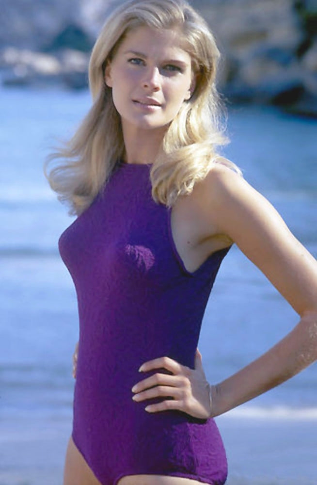 Candice Bergen posed in a purple one-piece photo print.