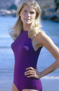 Candice Bergen posed in a purple one-piece photo print.