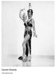 Carmen Miranda wearing a colorful lighthouse hat in a photo print