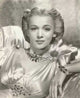 Carole Landis wearing a silk dress with jewels photo print.