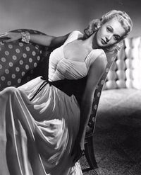 Carole Landis reclining on couch vintage photo print.