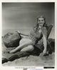Carole Landis sitting in a beach chair with a beach ball photo print