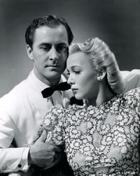 Carole Landis vintage photo print with a man holding her arm.