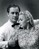 Carole Landis vintage photo print with a man holding her arm.
