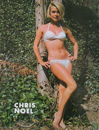 Chris Noel posing by a tree photo print