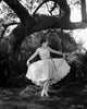 Clara Bow Under Tree Photo Print showcasing vintage Hollywood charm.