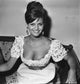 Claudia Cardinale Floral Top Photo Print showcasing the iconic actress in vibrant floral attire.