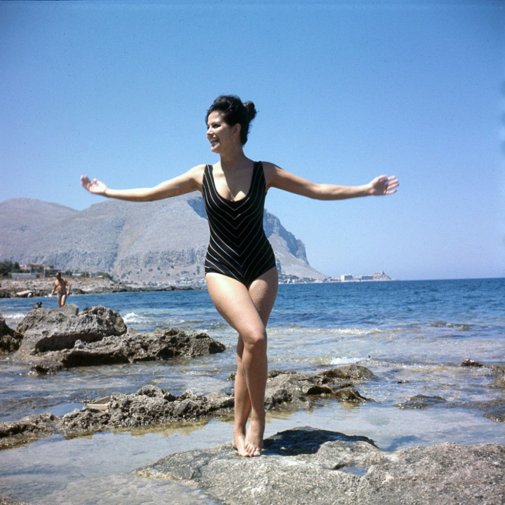 Claudia Cardinale Arms Out Photo Print capturing timeless elegance.