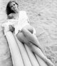 Claudia Cardinale Pool Float Photo Print showcasing vintage glamour.
