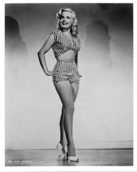 Cleo Moore Pose Photo Print showcasing vintage Hollywood elegance.