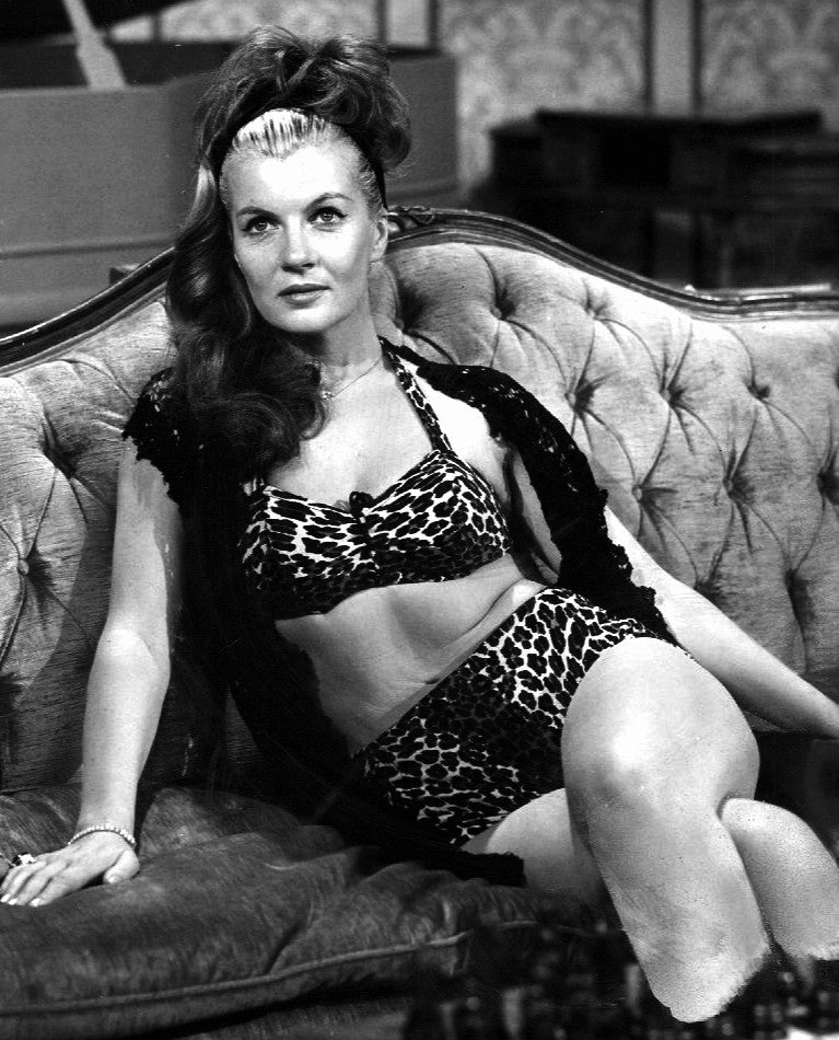 Corinne Calvet Couch Photo Print showcasing vintage Hollywood charm.