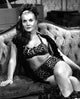 Corinne Calvet Couch Photo Print showcasing vintage Hollywood charm.