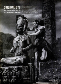 Cyd Charisse dancing around a tribal statue photo print