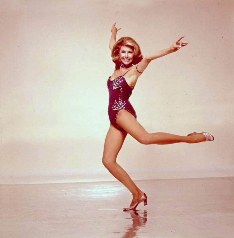 Cyd Charisse spinning photo print showcasing classic dance elegance.