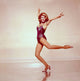 Cyd Charisse spinning photo print showcasing classic dance elegance.