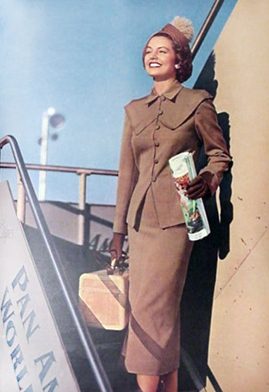 Cyd Charisse boarding airplane photo print featuring classic Hollywood elegance.