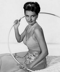 Cyd Charisse holding hoop photo print, classic Hollywood elegance.