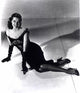 Cyd Charisse elegant photo print in black dress and gloves.