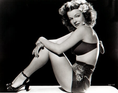 Dale Evans sitting with knees up photo print, capturing her joyful spirit.