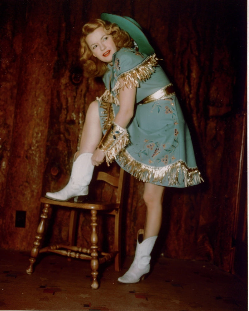 Dale Evans Cowgirl Boot on Stool Photo Print showcasing a classic boot.