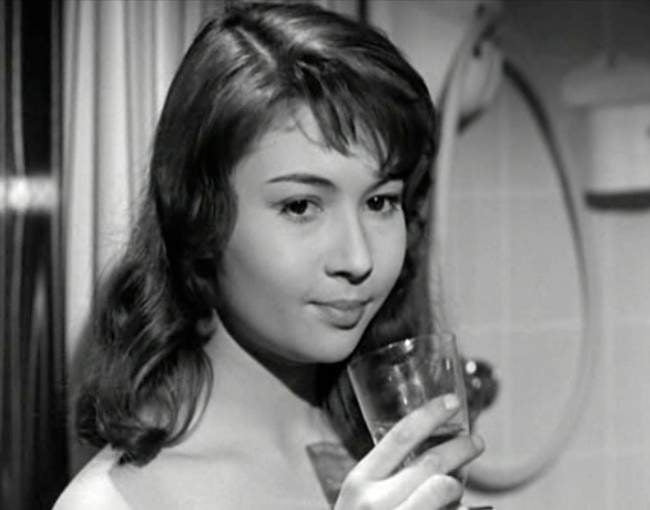 Dany Carrel Holding Glass Photo Print showcasing elegance and charm.
