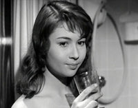 Dany Carrel Holding Glass Photo Print showcasing elegance and charm.