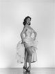 Dany Carrel Holding Up Dress Photo Print showcasing elegance.