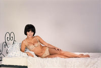 Dany Carrel Laying in Bed Photo Print showcasing serene beauty.