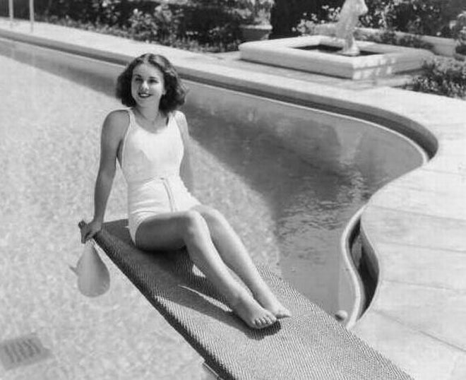 Deanna Durbin posed elegantly on a diving board, vintage photo print.