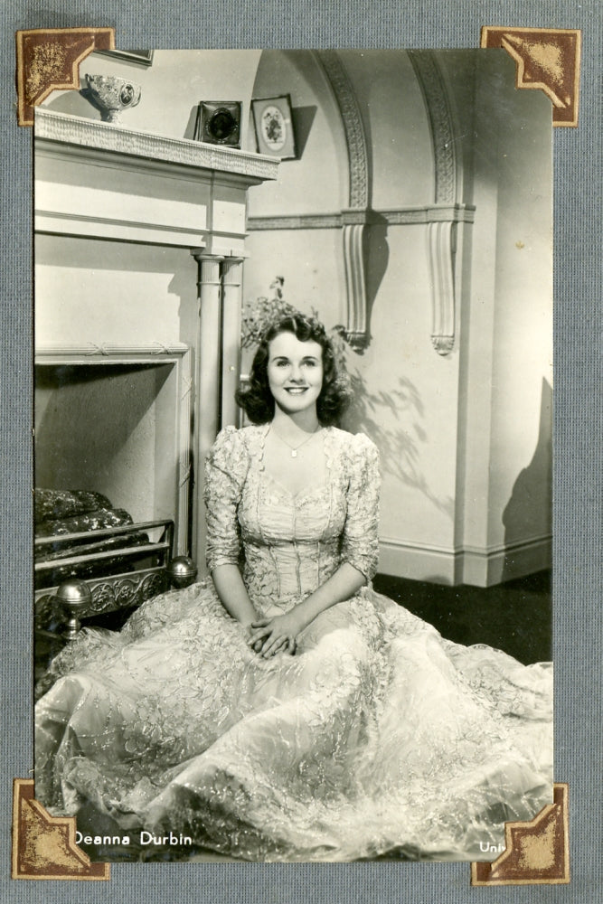 Deanna Durbin Fireplace Photo Print showcasing a classic film moment.
