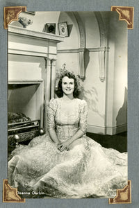 Deanna Durbin Fireplace Photo Print showcasing a classic film moment.