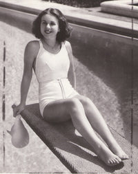 Deanna Durbing sitting on a diving board photograph