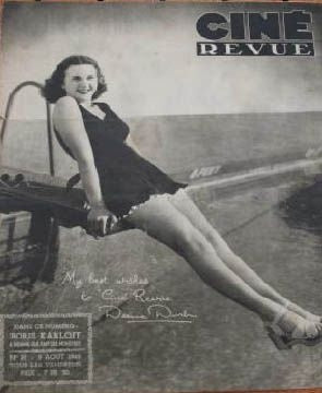 Deanna Durbin sitting on a diving board photo print