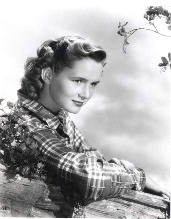 Debbie Reynolds leaning on log in plaid shirt photo print
