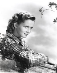 Debbie Reynolds leaning on log in plaid shirt photo print