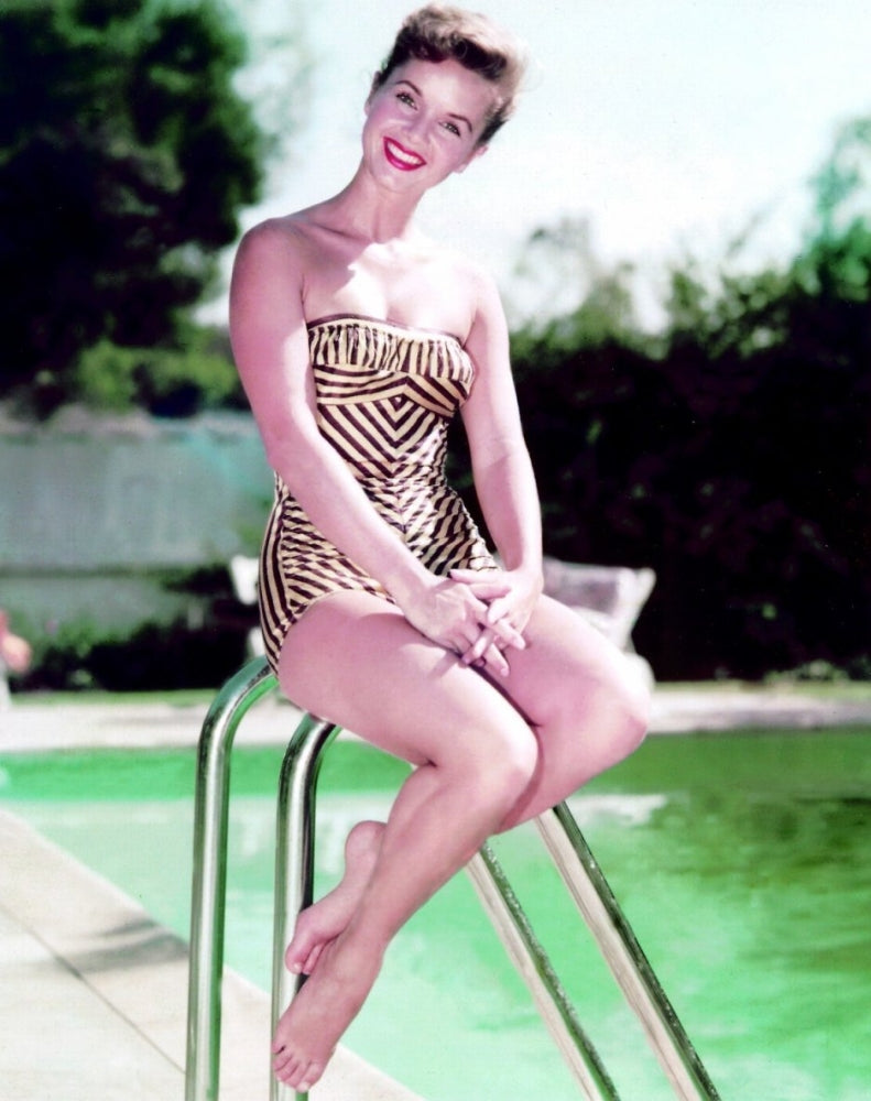 Debbie Reynolds on pool ladder photo print showcasing classic Hollywood charm.