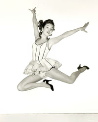 Debbie Reynolds Dancing Pose Photo Print showcasing her elegance in the air.