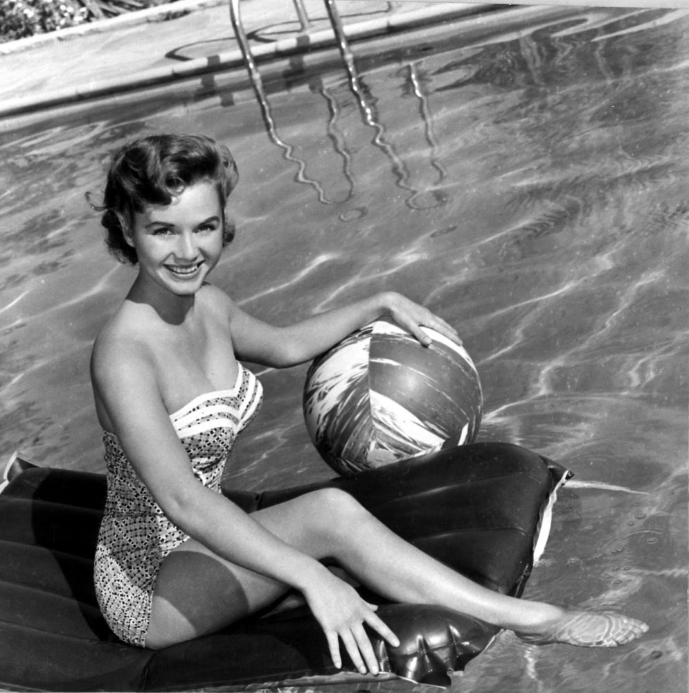Debbie Reynolds sitting on a pool float with ball photo print.