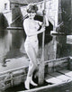 Deborah Walley holding a boat paddle in a captivating photo print.